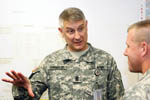 Sergeant Major of the Army Raymond Chandler III, talks with Command Sgt Maj. Wesley Weygandt, deputy commandant, U.S. Sergeant Major Academy, Fort Bliss, Texas, at the opening of the Army’s Sergeant Major Force Management Course at Thurman Lecture Hall, Army Management Staff College, Fort Belvoir, Monday.