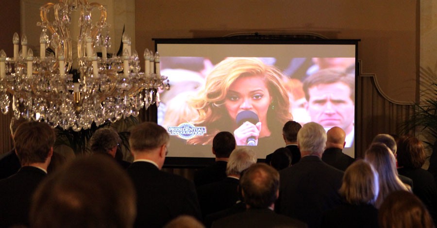 Guests at the U.S. Ambassador's residence in Berlin watch Beyonce perform the U.S. National Anthem during a live television broadcast of the 57th U.S. Presidential Inauguration, Berlin, Germany, January 21, 2013. [State Department photo/ Public Domain]