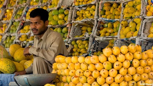 Vender waiting for customers at Sunday bazaar in Islamabad, Pakistan, July 5, 2009. [AP File]