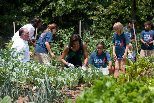 Michelle Obama with children in the White House garden