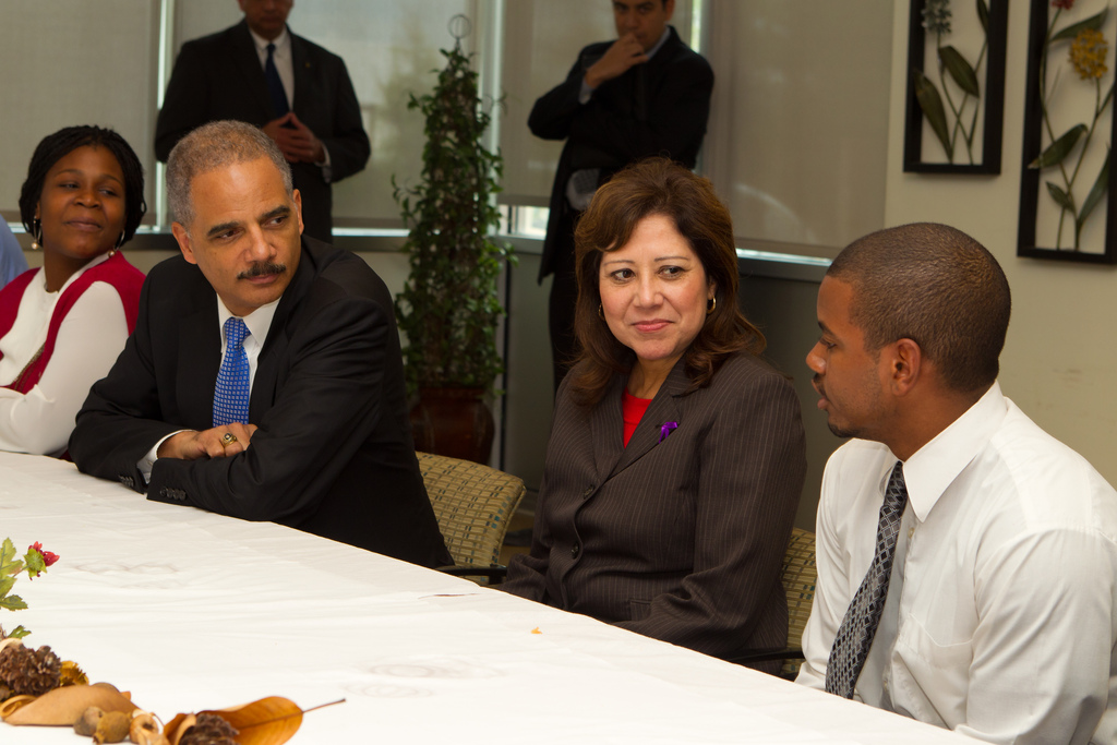 Attorney General Holder and Secretary Solis speak with young people at the center. 