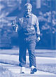 Image of an elderly man is walking.