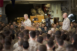 General James F. Amos, Commandant of the Marine Corps, addresses Marines and sailors with the 15th Marine Expeditionary Unit and Peleliu Amphibious Ready Group in the hangar bay of the USS Peleliu, Dec. 28. The CMC visited the ship to show support to the Marines and sailors of the 15th MEU and Peleliu ARG during the holidays. The 15th MEU is deployed as part of the Peleliu ARG as a U.S. Central Command theater reserve force, providing support for maritime security operations and theater security cooperation efforts in the U.S. 5th Fleet area of responsibility. (U.S. Marine Corps photo by Gunnery Sgt. Jennifer M. Antoine)