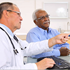 A doctor looks at medical images on a computer.