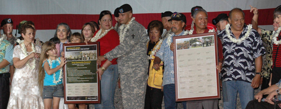 Forty-four state and local community leaders, military and family gathered to sign the Army Community Covenant during the Fourth of July celebration at U.S. Army Garrison, Hawaii.