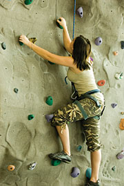 Image of a woman doing rock climbing