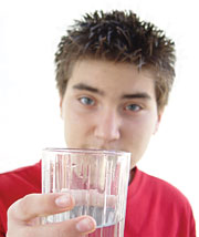 Image of a boy holding a glass of water
