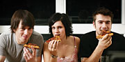 Image of teenagers eating pizza