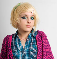 Teen girl with bleached hair and makeup.