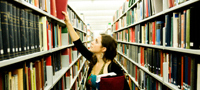 image of women in library stacks