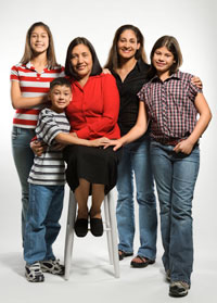 A family of four women and a young boy.