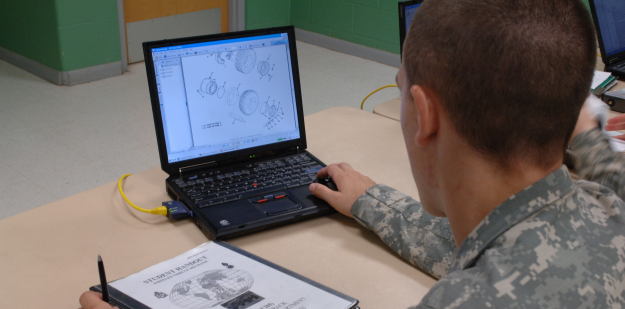 Army mechanic training with computer