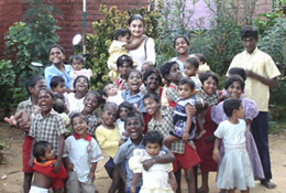 Tara Suri with many children.