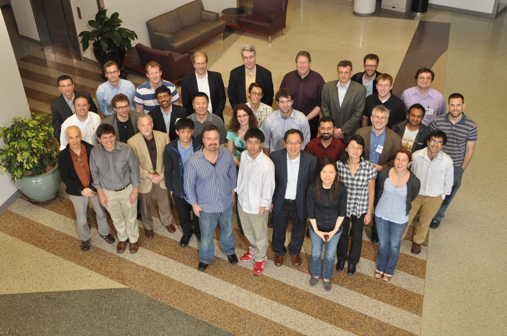 Group of scientists comprised of 28 men and four women, pose for a photo.