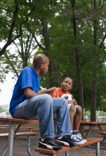mentor and mentee sitting on a picnic table