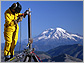 Researcher welding a GPS station on the flanks of Mount St. Helens