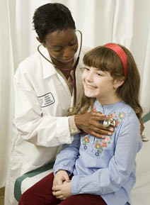 Pediatrician examining child