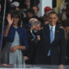 President Barack and First Lady Michelle Obama wave during inauguration festivities.