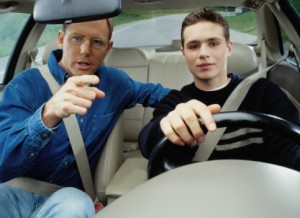 Dad teaching son how to drive