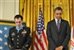 President Barack Obama and former Army Staff Sgt. Clinton L. Romesha stand during the benediction after the Medal of Honor ceremony at the White House in Washington, D.C., Feb. 11, 2013.  U.S. Army photo by Leroy Council