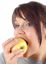 Image of a girls eating an apple