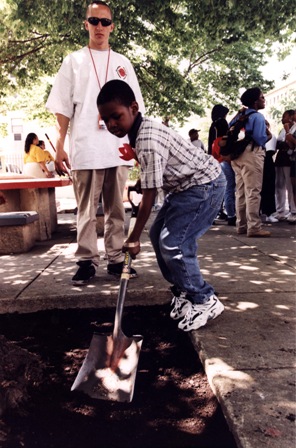 Boy and mentor doing community service