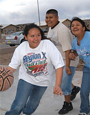 Image of teenagers playing basketball