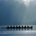 A row team glides across the water