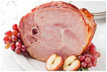 Roasted ham on white platter