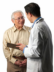 a senior citizen talking to his doctor