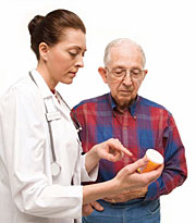 a senior citizen talking with his pharmacist
