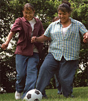 Image of teens playing soccer