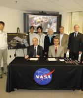 NASA and JAXA officials at the DPR Signing Event