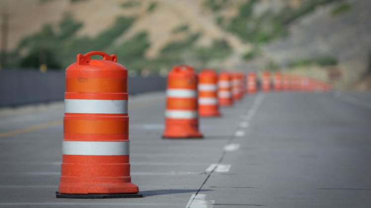 A highway lane closed with pylons.