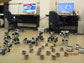 Photo of two computers and a terrestrial robot swarm