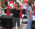 2010 Road Show - A woman tests her Body Mass Index (BMI) at The Heart Truth Road Show in Albuquerque, NM.