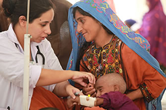 Image of a health care provider with a women and child