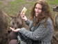 Photo of Michelle Meighan feeding a kangaroo during her summer in Tasmania.