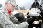 succession of booms rattles through the parking lot of Carey Gym on Camp Casey. 