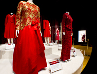 Dresses belonging to Barbara Bush (front left) and Laura Bush (front right) on display at the First Ladies Red Dress Collection on exhibit at the George Bush Presidential Library and Museum at Texas A&M University.