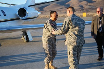 Gen. Dennis L. Via, commanding general of Army Materiel Command, is greeted by Lt. Col. Christopher Dexter and Donald Olson, as his plane touched down at Amedee Army Airfield on Sierra Army Depot, Calif.