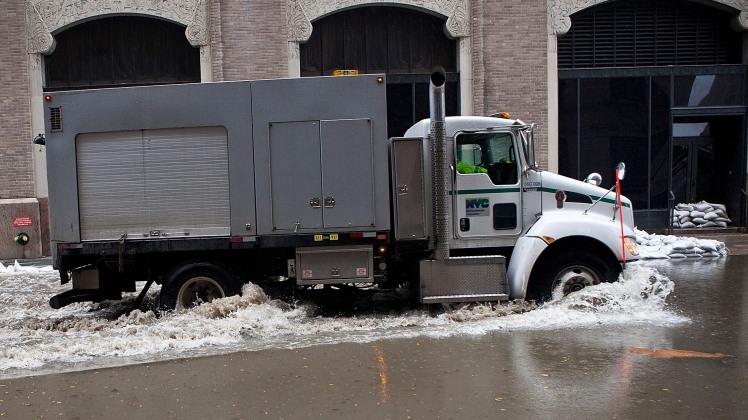 Photo of truck making its way through flooding