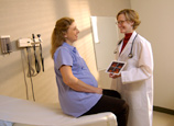 Doctor talking to pregnant woman