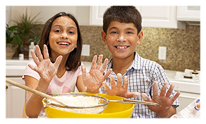 Boy and girl baking