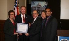Administrator Johnson and Commissioner Peck and others receive award for GSA's renovation of the Martin Luther, Jr. Federal Building