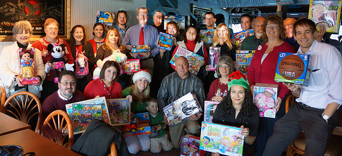 The Pennsylvania Rural Development staff and the toys that were donated to local children in need through the U.S. Marine Corps Toys for Tots Toy Drive.