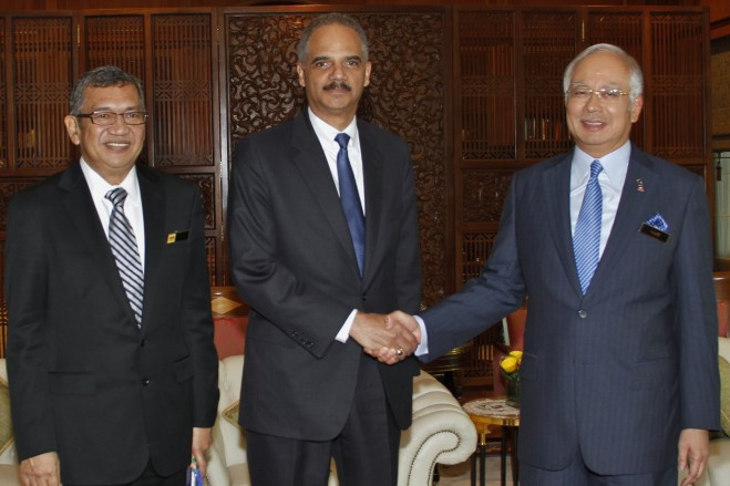 General Holder meeting with Malaysian Prime Minister Najib (right)and Malaysia Attorney General Gani (left).
