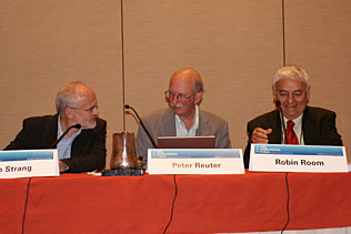 John Strang, United Kingdom; Peter Reuter, University of Maryland; Robin Room, Australia, sitting at the head table of the plenary session.