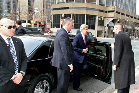 Date: 02/04/2013 Location: Suburban Washington, D.C. Description: U.S. Secretary of State John F. Kerry (second from right) is surrounded by four DS special agents as he steps out of his vehicle for a meeting at Diplomatic Security headquarters in suburban Washington, D.C., February 4, 2013. (U.S. Department of State photo) - State Dept Image