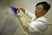 CBP Laboratory personnel use liquid nitrogen to supercool testing equiptment.